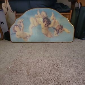 Vanitian Cherub paint scan on headboard.